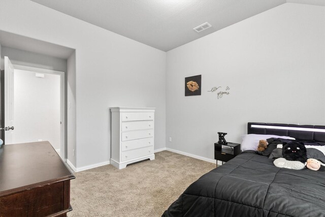 1319 Bridgewater Blvd, Celina, TX 75009 - carpeted bedroom with lofted ceiling and baseboards