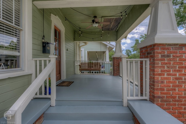view of patio featuring a ceiling fan and a porch