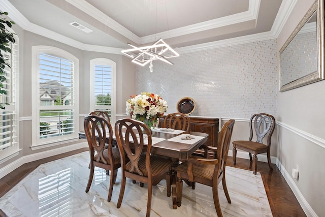 2604 Coyote Xing, Rockwall, TX 75087 - dining room featuring a chandelier, light wood-style flooring, crown molding, baseboards, and a raised ceiling