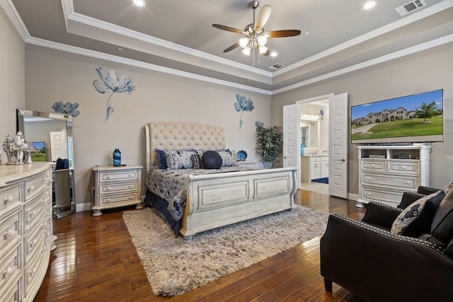 2604 Coyote Xing, Rockwall, TX 75087 - bedroom with a raised ceiling, dark wood-style floors, ornamental molding, connected bathroom, and recessed lighting