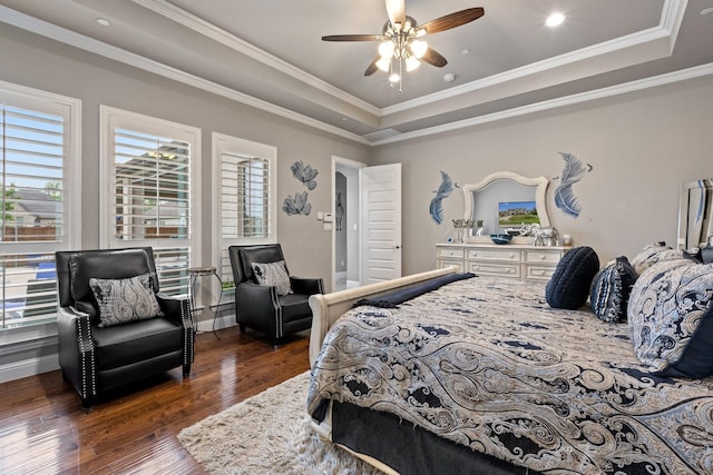 2604 Coyote Xing, Rockwall, TX 75087 - bedroom featuring a tray ceiling, dark wood-style floors, crown molding, baseboards, and ceiling fan