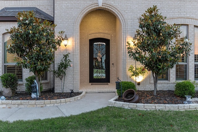 2604 Coyote Xing, Rockwall, TX 75087 - view of exterior entry featuring brick siding