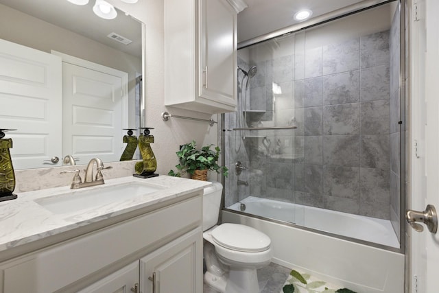 2604 Coyote Xing, Rockwall, TX 75087 - bathroom featuring vanity, toilet, and shower / bath combination with glass door