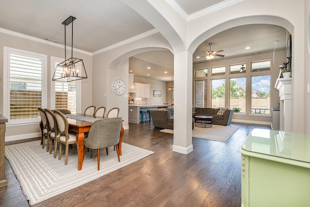 1607 Lilac Ln, Celina, TX 75009 - dining space featuring dark wood finished floors, a ceiling fan, crown molding, baseboards, and a chandelier