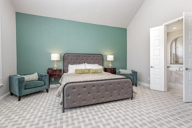 1607 Lilac Ln, Celina, TX 75009 - carpeted bedroom featuring baseboards, ensuite bathroom, and high vaulted ceiling