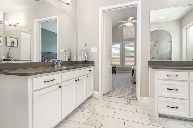 1607 Lilac Ln, Celina, TX 75009 - ensuite bathroom featuring marble finish flooring, a ceiling fan, vanity, a tile shower, and baseboards