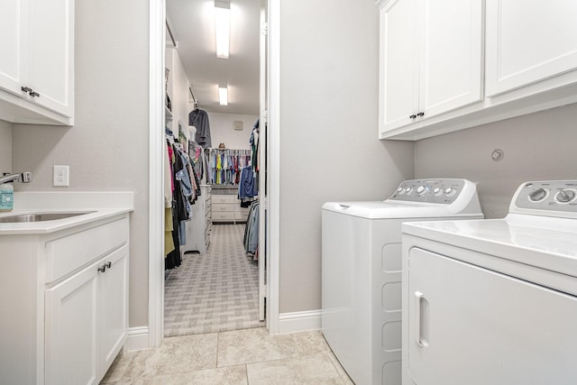 1607 Lilac Ln, Celina, TX 75009 - laundry room with washing machine and clothes dryer and cabinet space