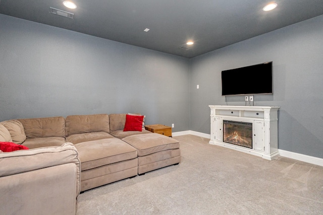 1607 Lilac Ln, Celina, TX 75009 - carpeted living area with baseboards, recessed lighting, and a glass covered fireplace