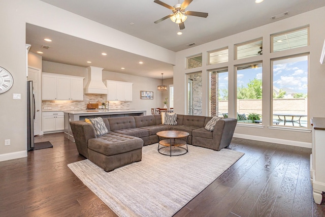1607 Lilac Ln, Celina, TX 75009 - living area with recessed lighting, a ceiling fan, dark wood-type flooring, and baseboards