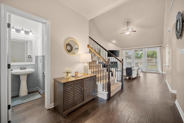 7608 White Fawn Rd, Arlington, TX 76002 - hallway featuring baseboards, dark wood finished floors, vaulted ceiling, a sink, and stairs