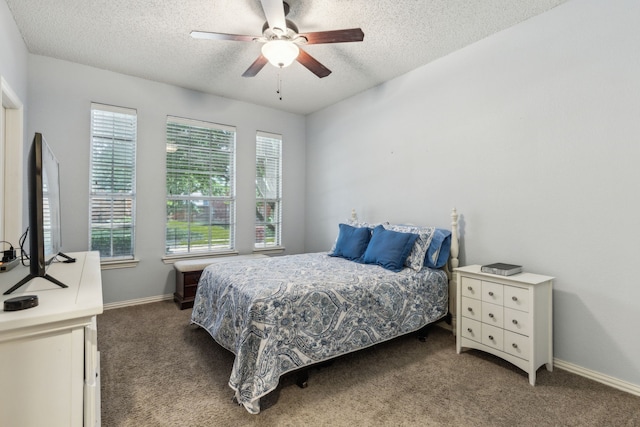 bedroom featuring a textured ceiling, carpet, baseboards, and ceiling fan