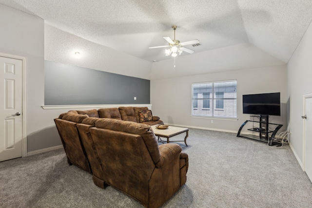 carpeted living room with a textured ceiling, a ceiling fan, baseboards, and lofted ceiling