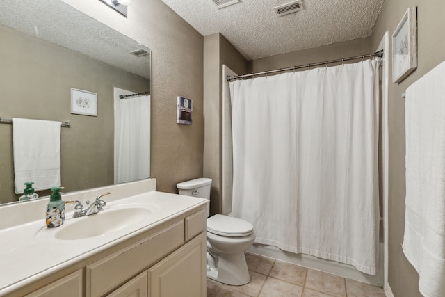 bathroom featuring a textured ceiling, toilet, vanity, tile patterned flooring, and shower / bathtub combination with curtain