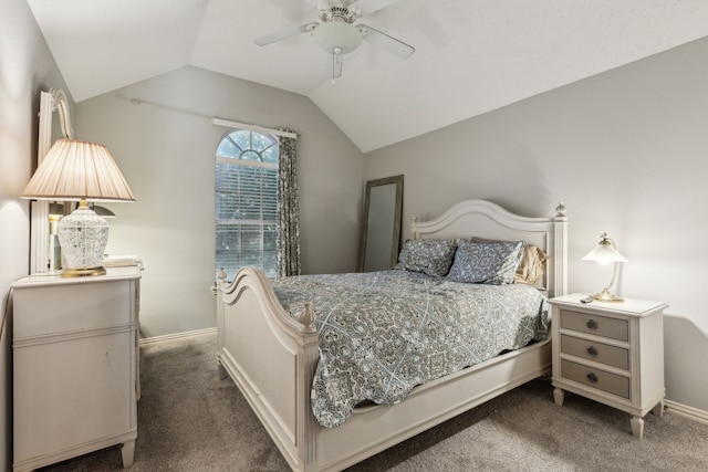carpeted bedroom with vaulted ceiling, baseboards, and a ceiling fan