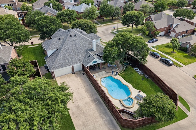 aerial view of residential area with a pool area