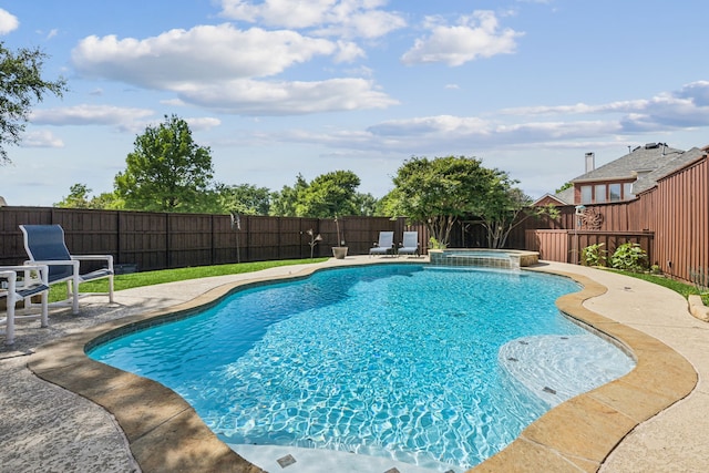 view of pool featuring a fenced backyard, a patio area, and a pool with connected hot tub