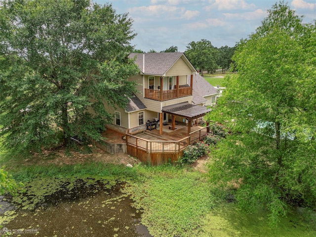 561 Linton Rd, Benton, LA 71006 - back of house with a balcony, roof with shingles, and a deck