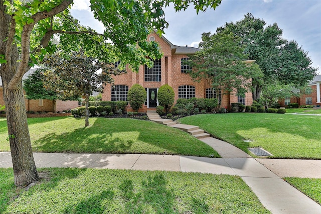 7627 Sweetgum Dr, Irving, TX 75063 - view of front of house featuring brick siding and a front lawn