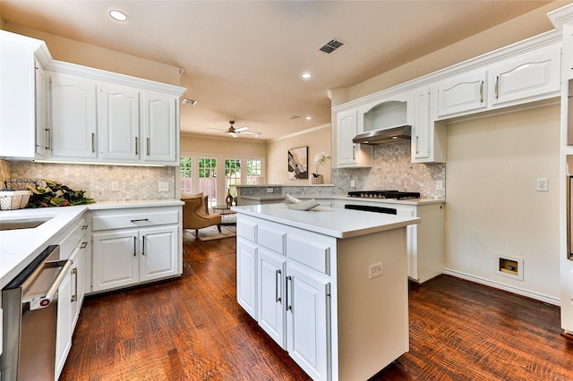 7627 Sweetgum Dr, Irving, TX 75063 - kitchen featuring stainless steel appliances, decorative backsplash, ceiling fan, light countertops, and white cabinets