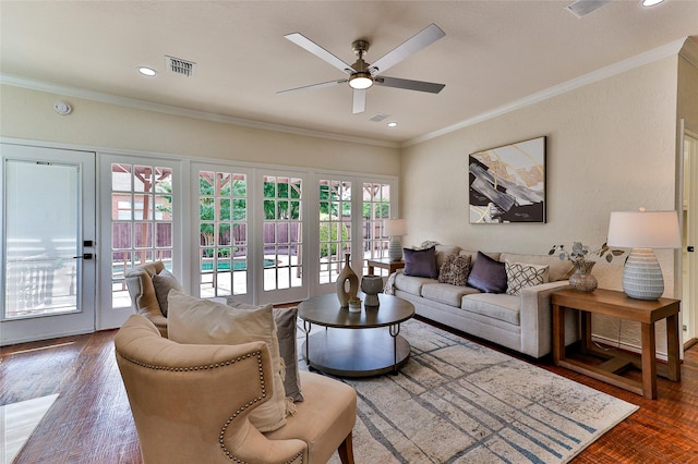 7627 Sweetgum Dr, Irving, TX 75063 - living room featuring a ceiling fan, crown molding, and wood finished floors