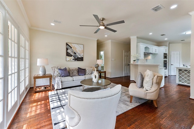 7627 Sweetgum Dr, Irving, TX 75063 - living room featuring a ceiling fan, baseboards, ornamental molding, dark wood-type flooring, and recessed lighting