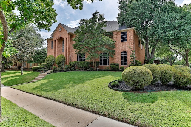 7627 Sweetgum Dr, Irving, TX 75063 - colonial inspired home featuring brick siding and a front yard