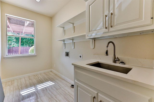 7627 Sweetgum Dr, Irving, TX 75063 - laundry room with hookup for an electric dryer, cabinet space, washer hookup, and baseboards