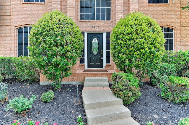 7627 Sweetgum Dr, Irving, TX 75063 - view of exterior entry featuring brick siding