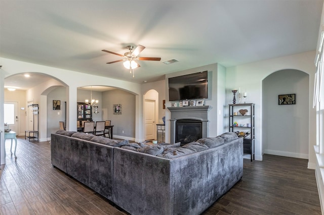 11312 Culberson Dr, Aubrey, TX 76227 - living area featuring a ceiling fan, dark wood-type flooring, a glass covered fireplace, and baseboards