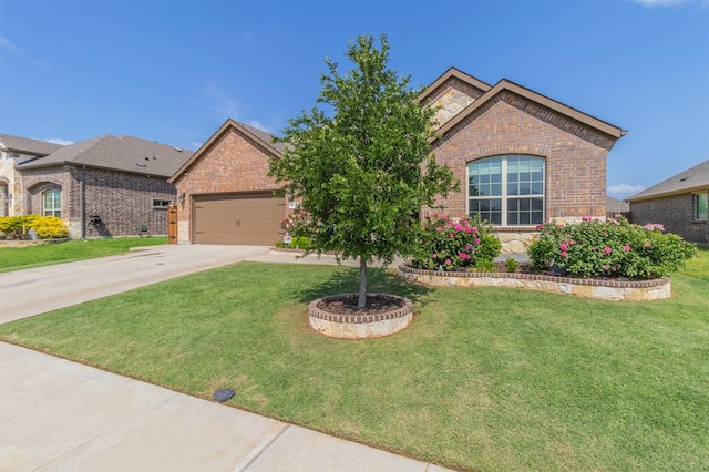 11312 Culberson Dr, Aubrey, TX 76227 - view of front facade featuring brick siding, concrete driveway, and a front lawn