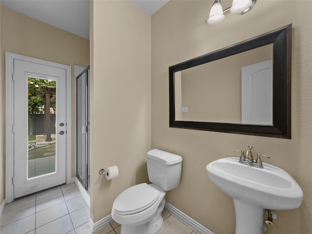 5143 Pond Bluff Way, Fairview, TX 75069 - bathroom with a shower stall, toilet, tile patterned flooring, and baseboards