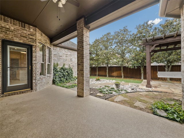 5143 Pond Bluff Way, Fairview, TX 75069 - fenced backyard with ceiling fan and a patio area