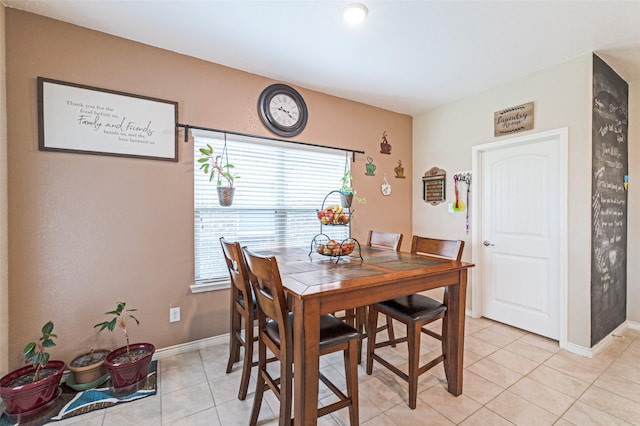 820 Lake Sierra Way, Little Elm, TX 75068 - dining space featuring light tile patterned floors and baseboards