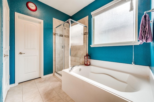 820 Lake Sierra Way, Little Elm, TX 75068 - full bathroom with a stall shower, a garden tub, tile patterned flooring, and baseboards