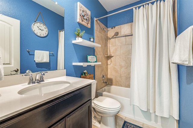 820 Lake Sierra Way, Little Elm, TX 75068 - bathroom featuring shower / tub combo with curtain, toilet, tile patterned floors, vanity, and a textured wall