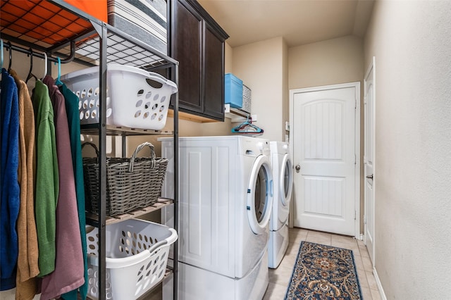 820 Lake Sierra Way, Little Elm, TX 75068 - laundry room featuring washer and clothes dryer, cabinet space, light tile patterned flooring, and baseboards