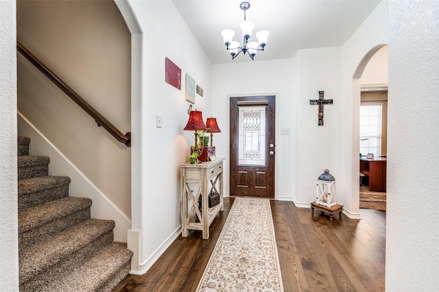 820 Lake Sierra Way, Little Elm, TX 75068 - entrance foyer featuring arched walkways, dark wood-style flooring, stairway, a chandelier, and baseboards