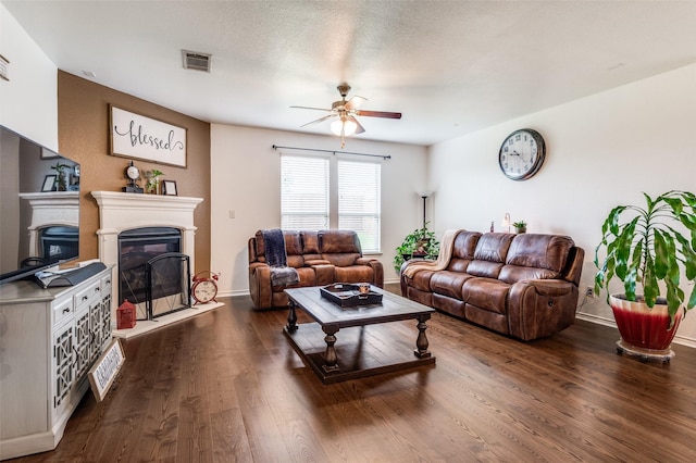 820 Lake Sierra Way, Little Elm, TX 75068 - living room with ceiling fan, a glass covered fireplace, dark wood-style floors, and baseboards