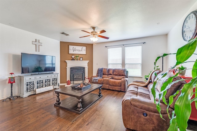 820 Lake Sierra Way, Little Elm, TX 75068 - living room featuring a ceiling fan, a glass covered fireplace, wood finished floors, and baseboards