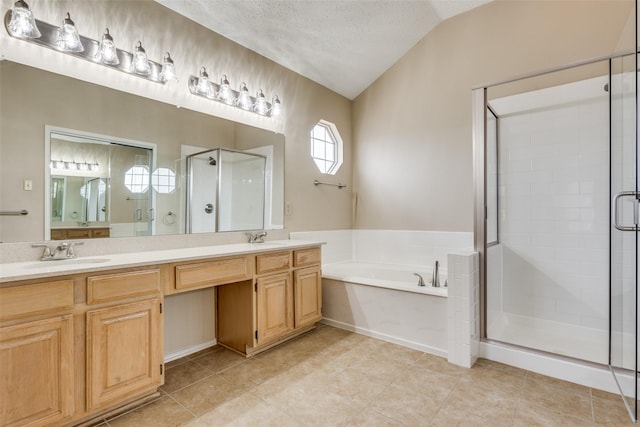 7816 Hardwick Ct, Plano, TX 75025 - bathroom featuring a garden tub, lofted ceiling, a stall shower, double vanity, and tile patterned floors