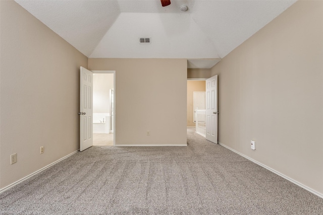 7816 Hardwick Ct, Plano, TX 75025 - unfurnished bedroom with lofted ceiling, carpet floors, connected bathroom, and baseboards