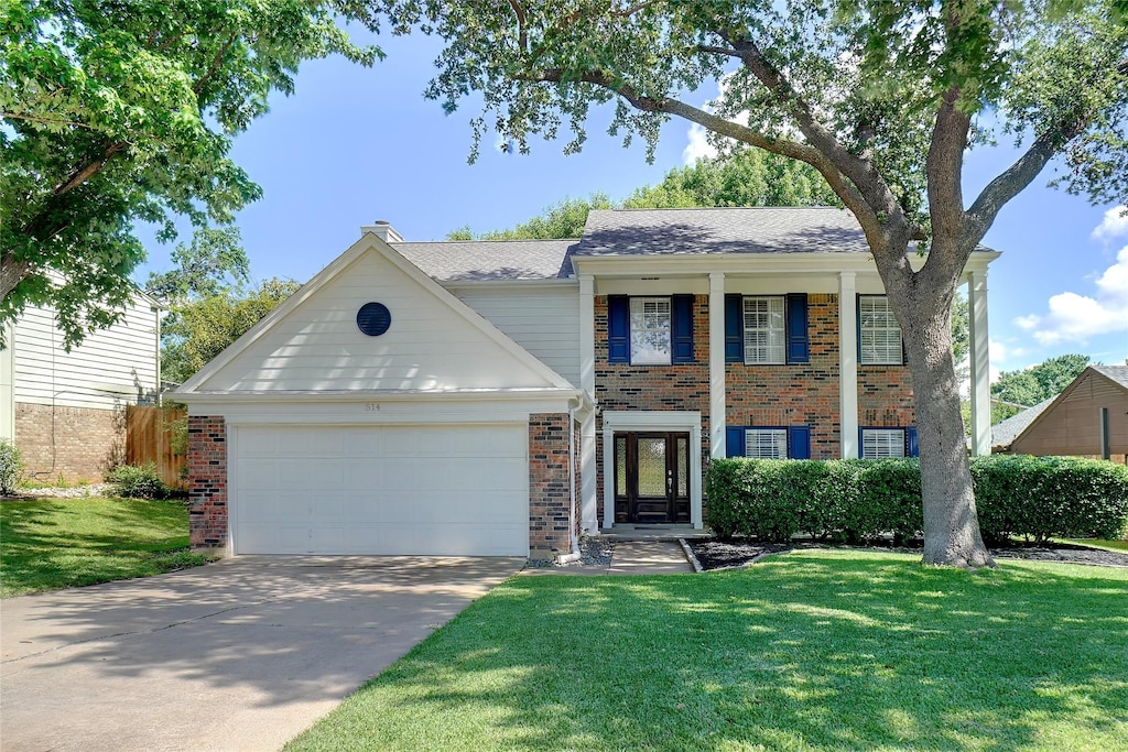 514 Chasewood Dr, Grapevine, TX 76051 - greek revival inspired property with brick siding, a garage, a front yard, and concrete driveway