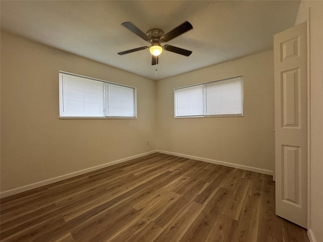 140 Shirley Dr, Lacy Lakeview, TX 76705 - empty room featuring baseboards, dark wood finished floors, and ceiling fan