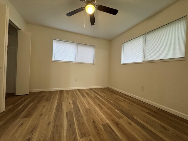 140 Shirley Dr, Lacy Lakeview, TX 76705 - unfurnished bedroom featuring baseboards, wood finished floors, and a ceiling fan