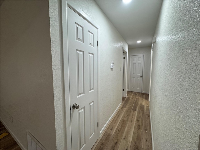 140 Shirley Dr, Lacy Lakeview, TX 76705 - corridor with a textured wall, wood finished floors, baseboards, and recessed lighting