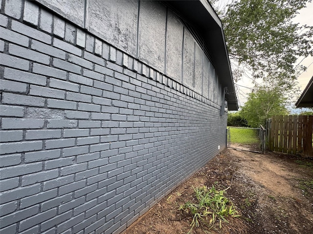 140 Shirley Dr, Lacy Lakeview, TX 76705 - view of side of home featuring brick siding and fence