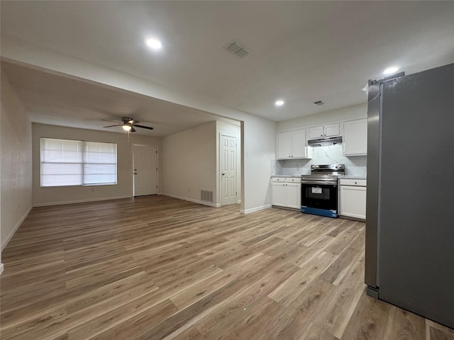 140 Shirley Dr, Lacy Lakeview, TX 76705 - kitchen with stainless steel appliances, under cabinet range hood, light wood-style flooring, a ceiling fan, and baseboards