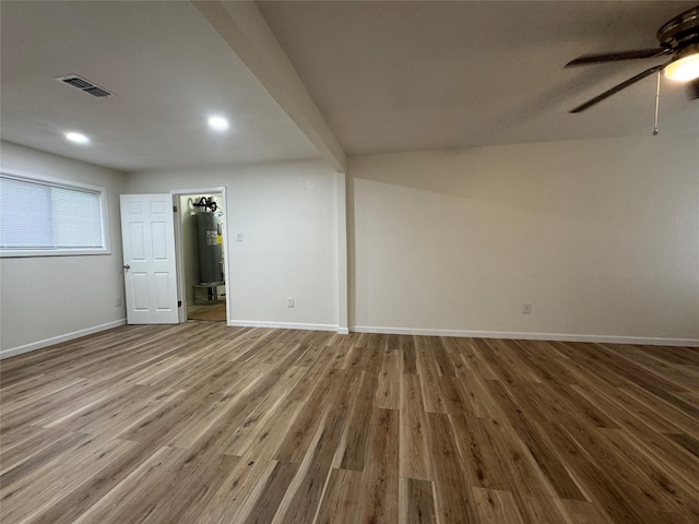 140 Shirley Dr, Lacy Lakeview, TX 76705 - below grade area with a ceiling fan, wood finished floors, baseboards, electric water heater, and recessed lighting