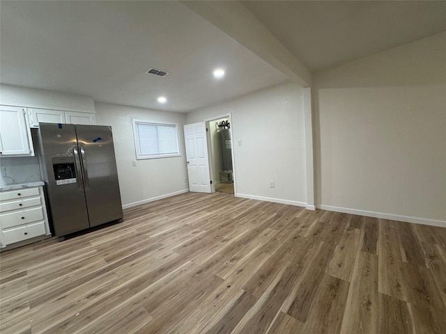 140 Shirley Dr, Lacy Lakeview, TX 76705 - kitchen featuring stainless steel fridge with ice dispenser, white cabinets, light wood-type flooring, baseboards, and recessed lighting