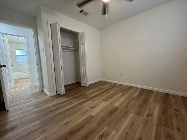 140 Shirley Dr, Lacy Lakeview, TX 76705 - unfurnished bedroom with wood finished floors, baseboards, a closet, and ceiling fan